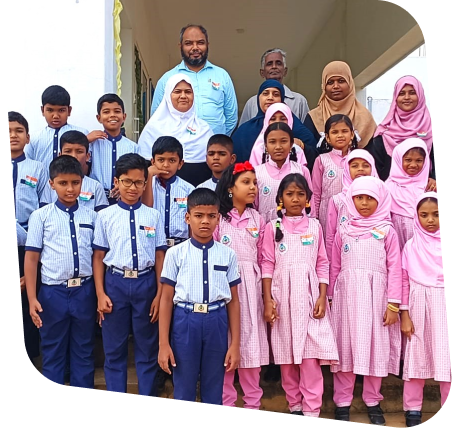 Students in pink and blue uniforms