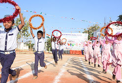Students in a cultural event with decorative rings